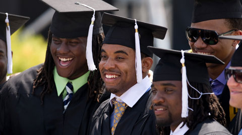Male students in black caps and gowns