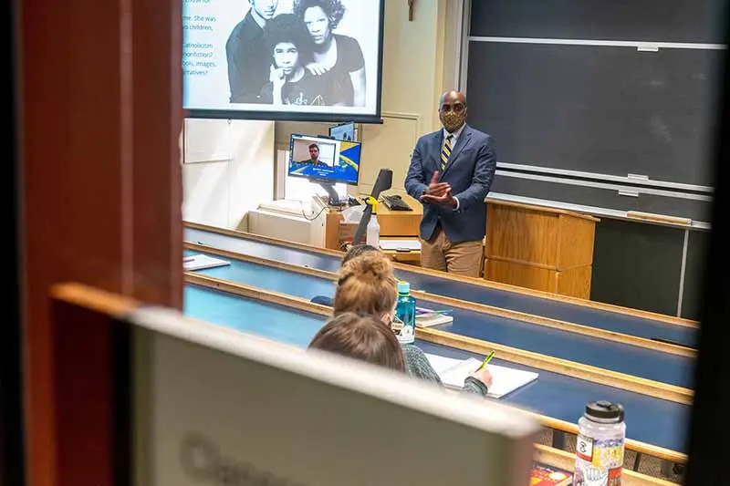 Ernest Morrell stands at the front of a classroom