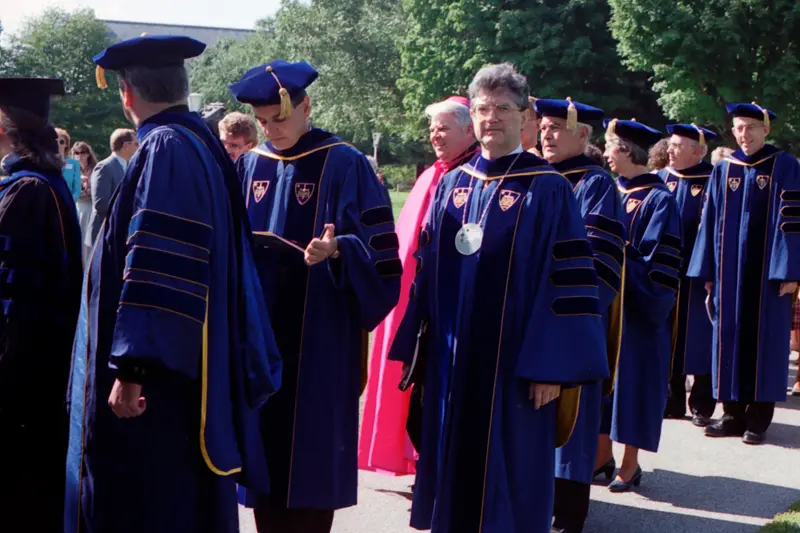 Faculty participate in a processsion across campus for inauguration in 1987.