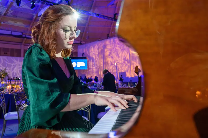 A close up of Miriam Rice playing the piano