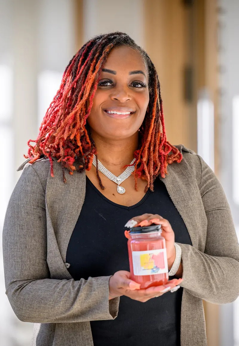 Laquisha Hunt holds a jar of one of her Heavenly Sent Sea Moss products.