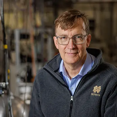 Graham Peaslee in his lab surrounded by equipment used to test for PFAS.