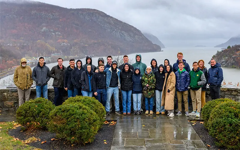 Notre Dame Army cadets and staff pose for a group photo at Trophy Point overlooking the Hudson River at the United States Military Academy at West Point.