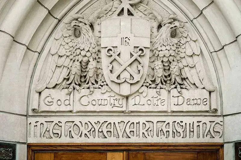 The inscription God, Country, Notre Dame carved above the east door of the Basilica of the Sacred Heart.