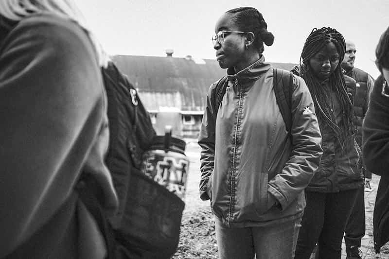 A woman stands and reflects at the Emmett Till Historic Intrepid Center.