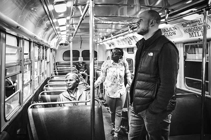 A man and a woman browse through a re-creation of the bus on which Rosa Parks was arrested in.